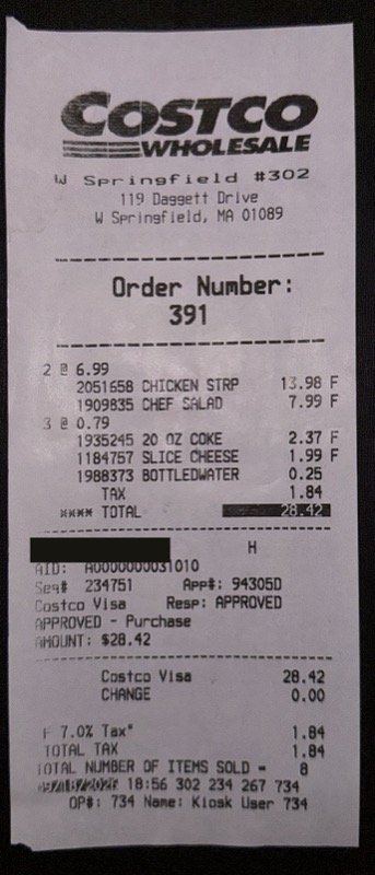 The food court receipt, with the card number blacked out.