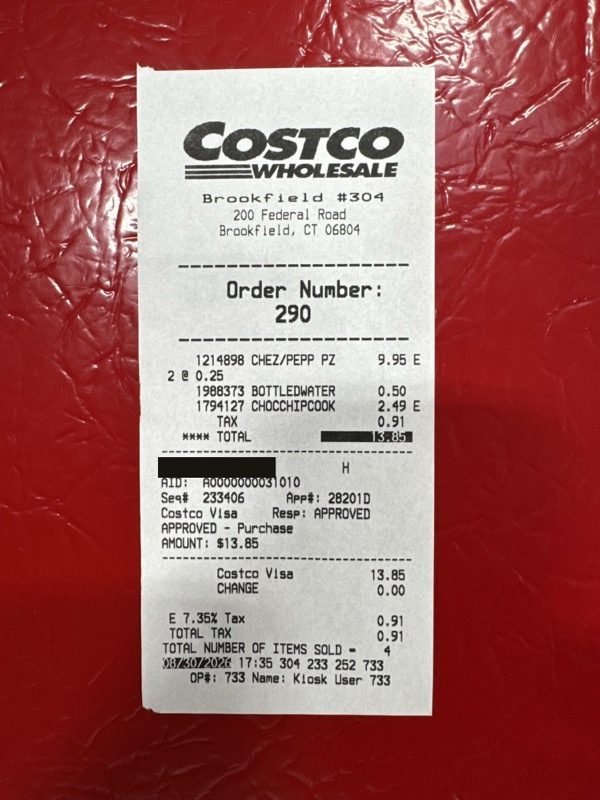 The food court receipt, with the card number blacked out.